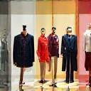 Icon depicting retail apparel display with mannequins in boutique setting